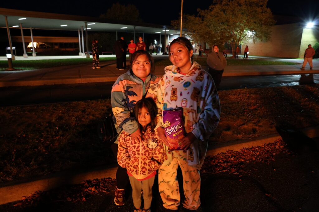 Students gathered outside during an evening Liberty Central School District event.