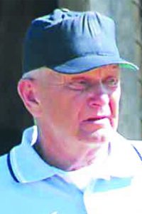 kurt schiebe, alumni of liberty and honoree of wall of fame, looking away from camera, wearing a hat and white tee shirt