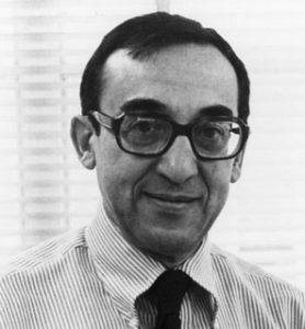 steven ippolito, alumni of liberty and honoree of wall of fame. black and white photo, wearing glasses and a tie, smiling facing camera